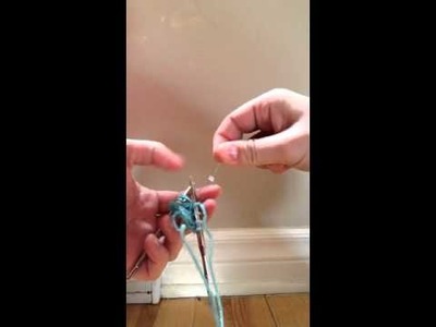 How to insert a bead while knitting with an iron thread