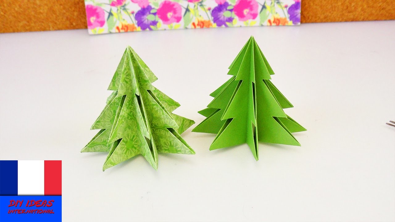 Sapin de Noël origami. Pliage pour les fêtes. Papier et ciseaux
