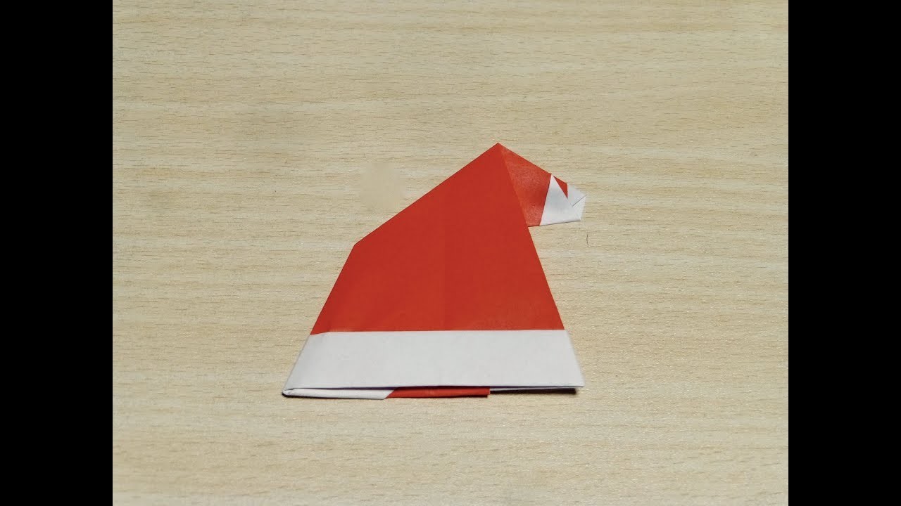 Comment faire Chapeau du père Noël. Origami. L'art de plier le papier.