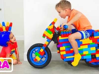 Vlad et Nikita conduisent un vélo de course pour enfants et s’amusent avec des jeux